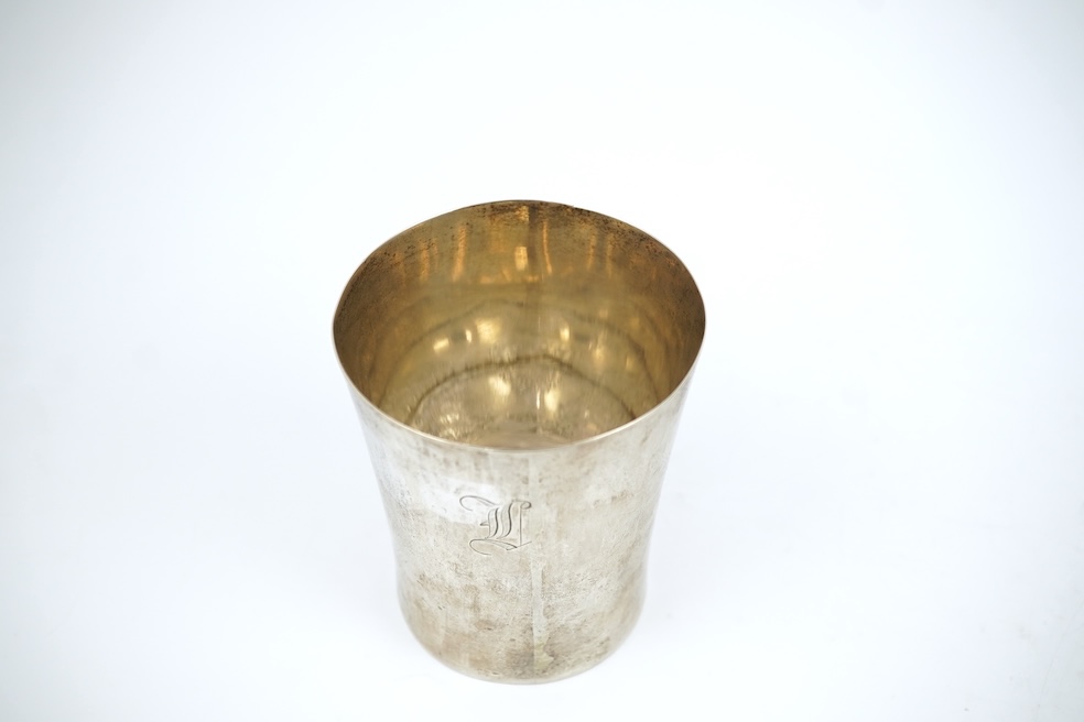 A white metal beaker the base inset with a silver medal commemorating the Peace of Oliva, 1660, Obv. Bird's-eye view of the city of Danzig with troops moving in foreground; above, an eagle crowned, an olive branch in its